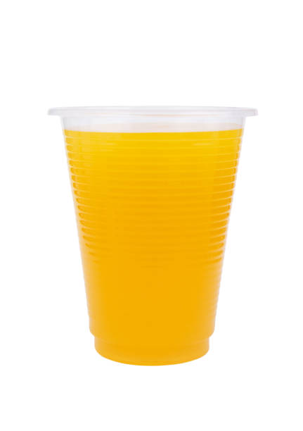istock Orange juice in plastic cup isolated 1271877407