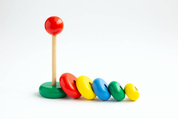 istock Pyramid from colored wooden rings on a white background. 1271881172