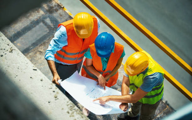 istock Group of contractors at the construction site. 1271882527