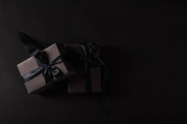 istock gift box wrapped in black paper and black bow ribbon 1271884151