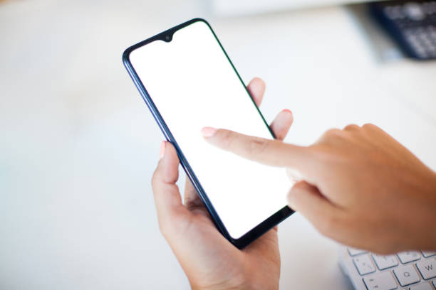 istock Close up woman hand using a smart phone with blank screen 1271886906