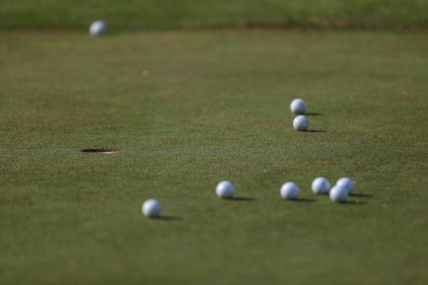 istock Golf balls on a putting green 1271887163