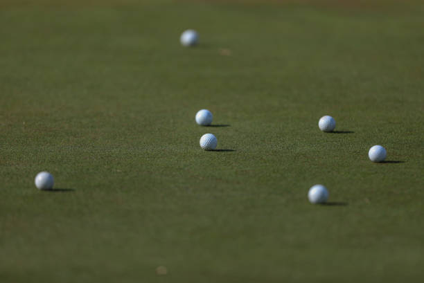 istock Golf balls on a putting green 1271887186