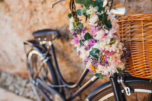 Beautiful wedding floral wreath on a bicycle, selective focus