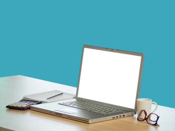 istock Laptop with blank screen mockup on table at home 1271893655