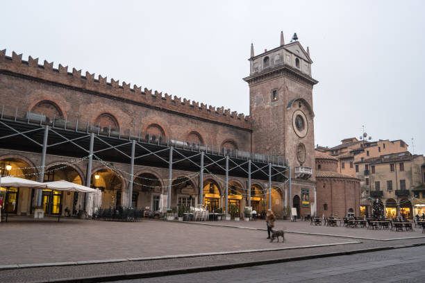Mantua, Lombardy, Italy, December 2015: The Clock Tower of the Rotonda San Lorenzo church, located in Piazza delle Erbe Mantua, Lombardy, Italy, December 2015: The Clock Tower and The church of the Rotonda San Lorenzo located in Piazza delle Erbe. san lorenzo rome photos stock pictures, royalty-free photos & images