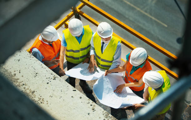 istock Group of contractors at the construction site. 1271899640