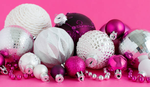 istock Christmas baubles on a purple background 1271900564