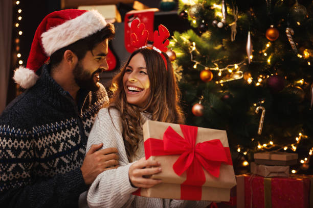 istock Man giving a Christmas present to his girlfriend 1271900784