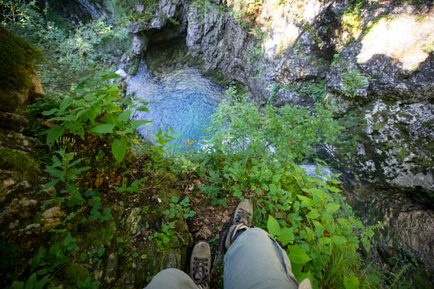 istock Personal Perspective of a Hiker Looking Down on a Stream Pool From a Cliff 1271904880
