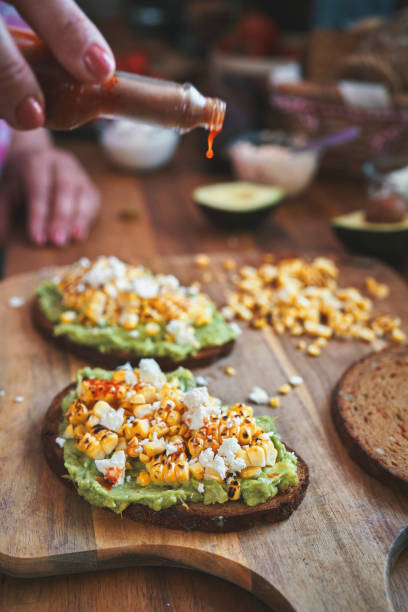 istock Avocado Sandwich with Brown Bread, Corn and Feta Cheese 1271904941