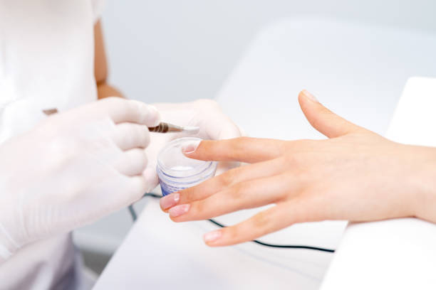 istock Process of applying acrylic powder on the nails 1271906125