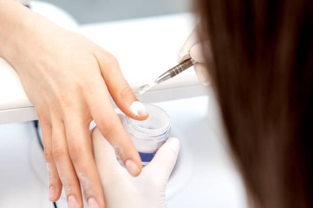 istock Process of applying acrylic powder on the nails 1271906134