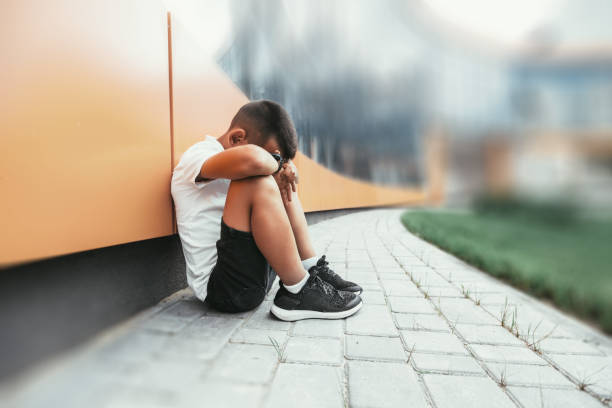 istock child  in depression is sitting on the floor doesn't want back to school 1271906355