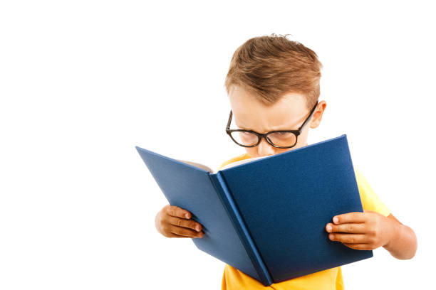 istock child reads a book against a bright wall 1271906409