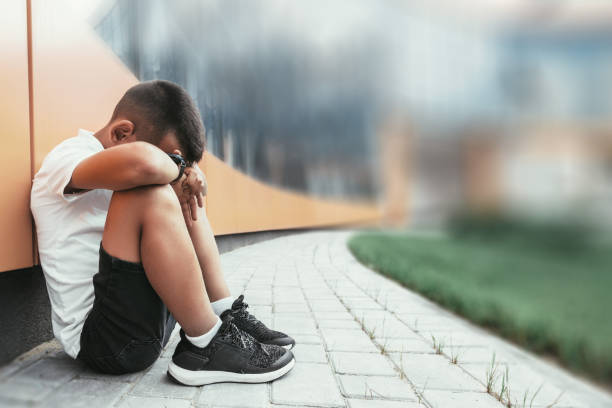 istock child  in depression is sitting on the floor doesn't want back to school 1271906519