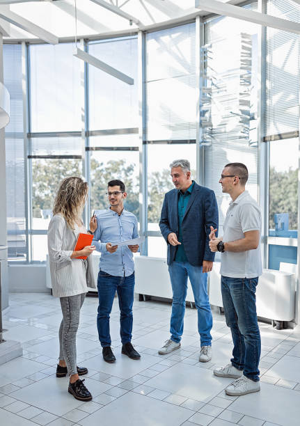 istock Group of business people in the lobby 1271907310