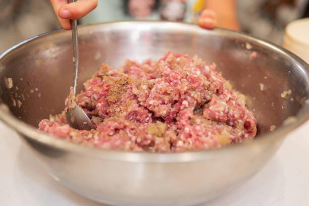 istock making hamburgers in kitchen with ground beef 1271909671