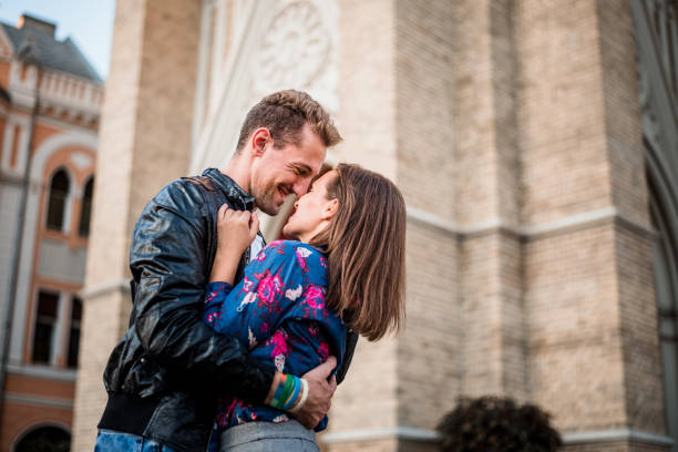 Romantic young couple kissing in the manor house background. Vintage tone