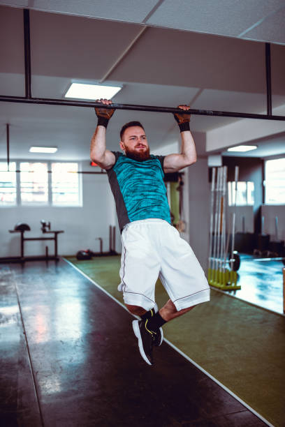 istock Male Giving His Full Strength During Gym Pullups 1271911039