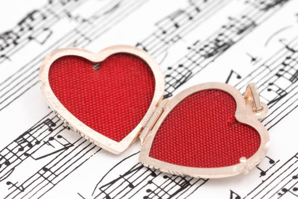 istock Pendant red heart on the notes background 1271912235