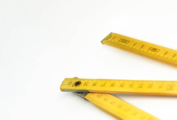 istock a yellow wooden folding ruler isolated on a white background 1271912317