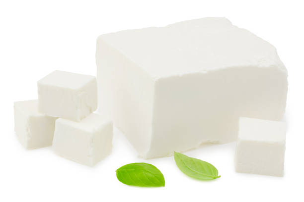 istock feta cheese with basil isolated on white background. Clipping path and full depth of field 1271912451