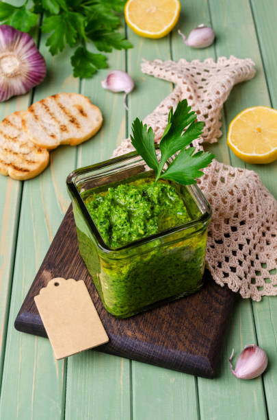 istock Green sauce in a glass jar 1271914225