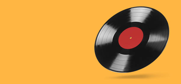 istock Analog vinyl record isolated on orange background 1271915363