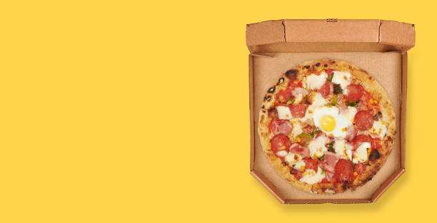 istock italian pizza in a box top view on yellow background 1271915409