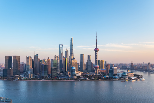 dusk scene in shanghai, beautiful pudong financial center and huangpu river in sunset, China.