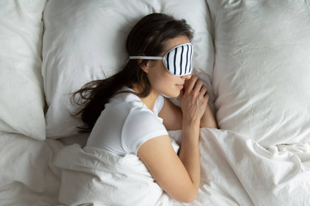 istock Top view peaceful young female wearing mask sleeping on side 1271917108