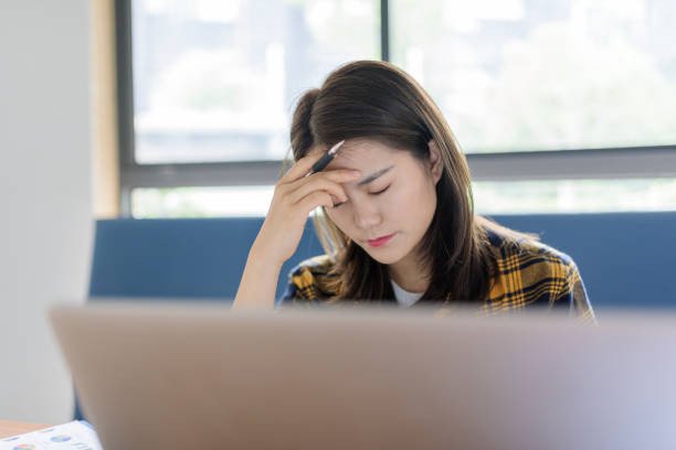 istock Young Asian woman working with laptop at office. 1271917381