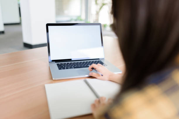 istock Woman using laptop to work on desk. 1271917522