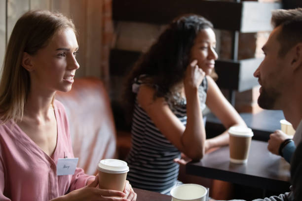istock Close up diverse people participating in speed dating in cafe 1271918871