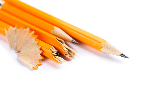 sharpened pencils on a wooden background closeup.