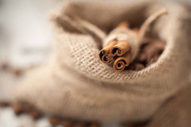 cinnamon sticks on wooden background