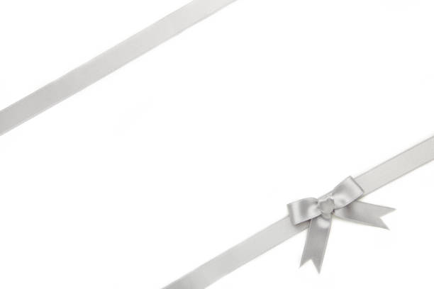 istock Silver ribbon and bow isolated on white background. 1271923480