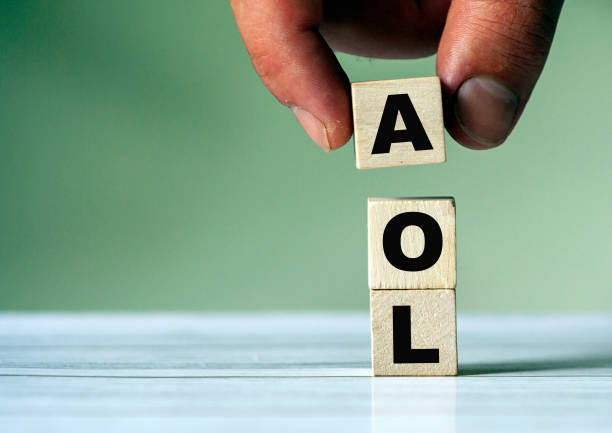 istock The hand puts the cube block with the inscription AOL 1271927760
