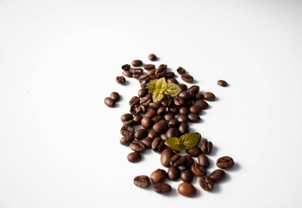 Grains of coffee on a white background. Different shapes made from grains
