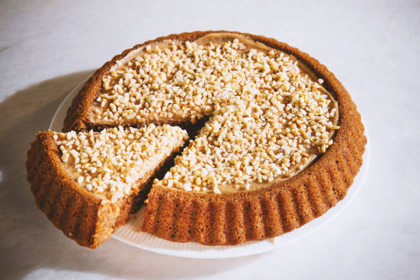 Healthy cake with peanut butter and with nuts. Homemade Healthy cake with peanut butter and with nuts on a marble background. heathy snack stock pictures, royalty-free photos & images