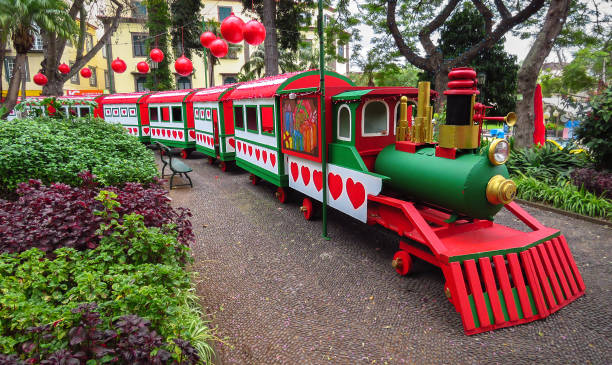 Christmas time, large decorated train in red, green and white, Municipal Garden of Funchal (Jardim Municipal do Funchal), Madeira Island, Portugal, Europe