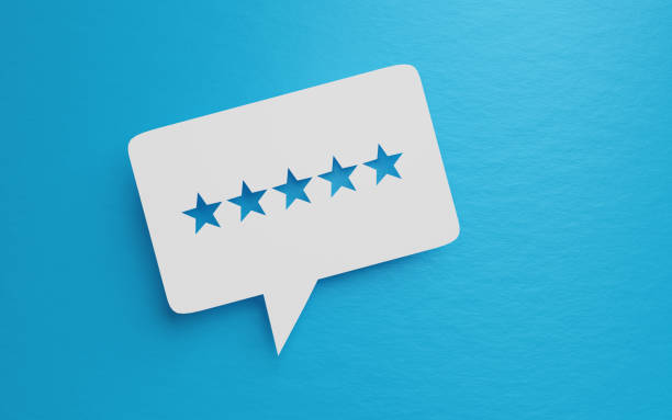 istock White Chat Bubble With Cut Out Star Shapes Over Blue Background For Feedback Concepts 1271930863