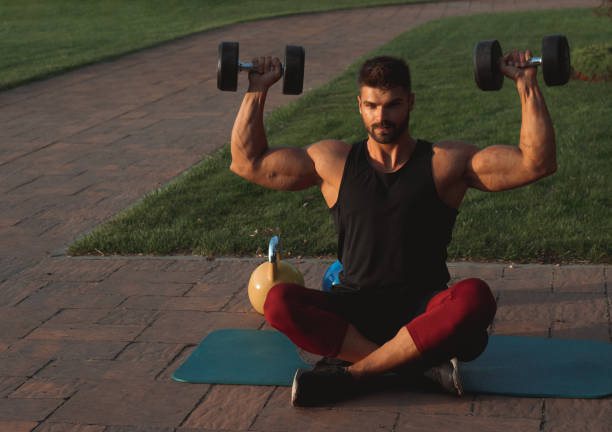 istock Muscular young man exercising in backyard 1271931905