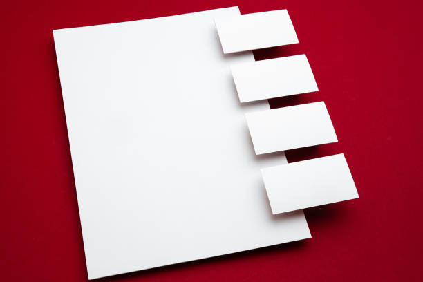 istock Blank flyer poster isolated on red background to replace your design 1271932405