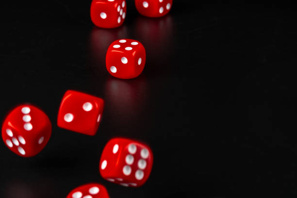 istock Group of dice close up on dark black background 1271932430