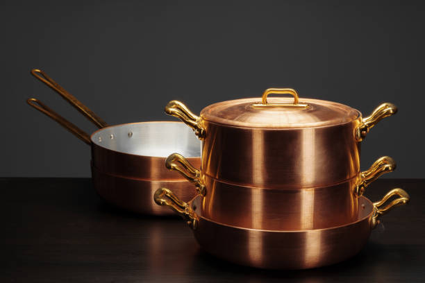 istock Shiny vintage copper cookware over dark background 1271932581