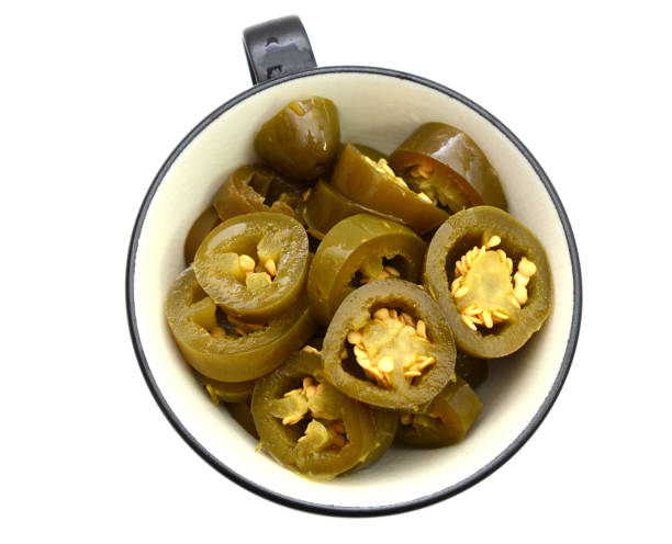 istock Pickled Jalapeno Pepper slices on cup 1271937991