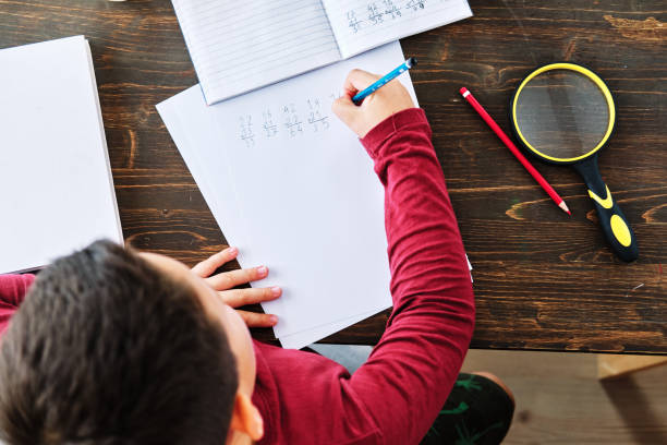istock Education at home. Cute child learning mathematics at home. Homeschooling 1271939357