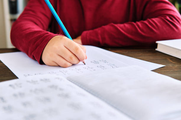 istock Education at home. Cute child learning mathematics at home. Homeschooling 1271939370